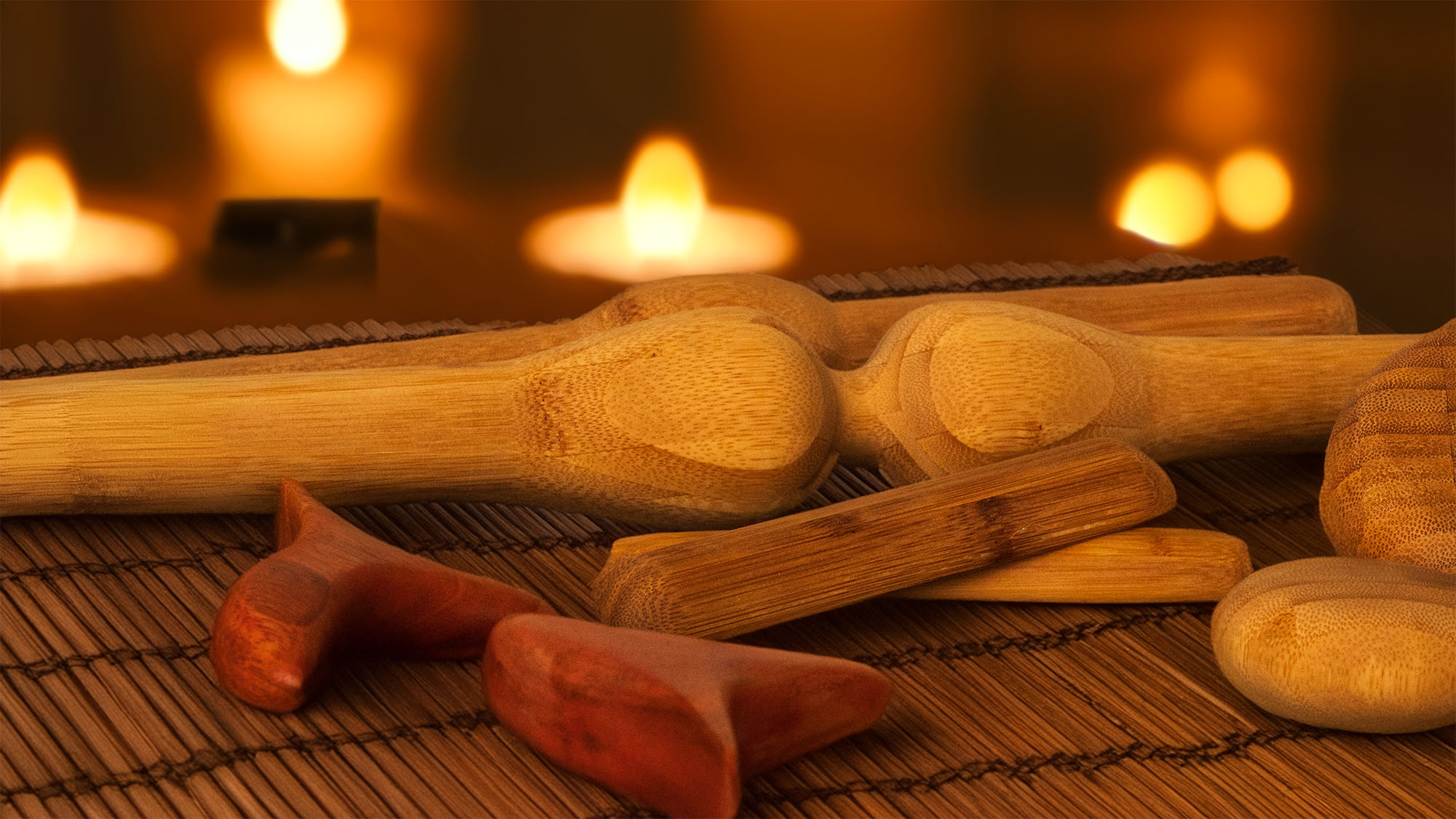 Variety of bamboo massage pins and tools.